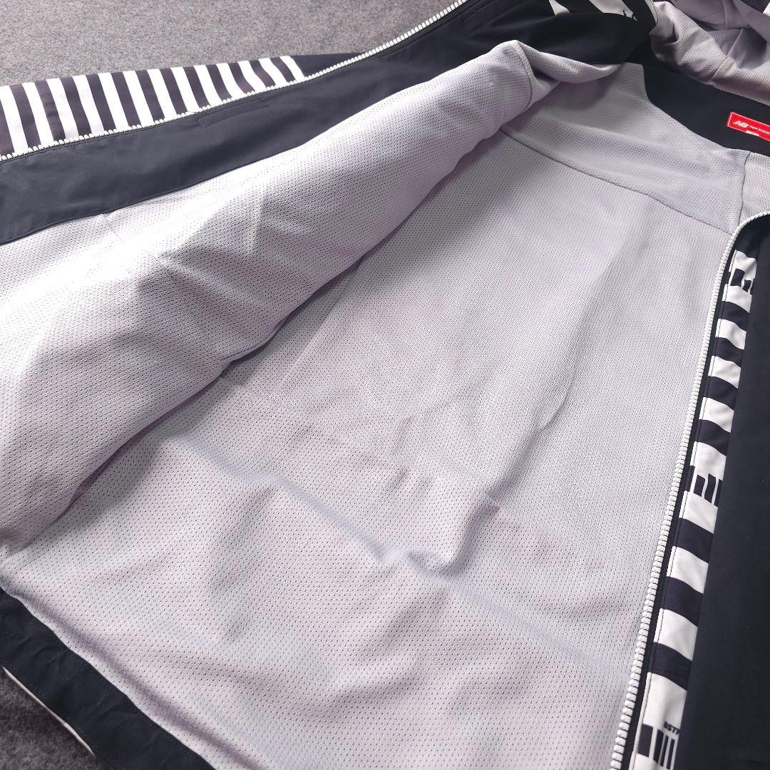 ニューバランスゴルフ 6 XL 撥水ブルゾンジャケット フード 総柄 黒